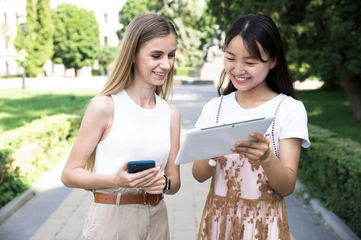 front-view-girls-looking-tablet_23-2148212331.jpg