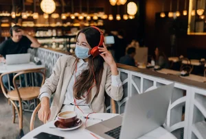 girl-sitting-coffee-shop-with-headphones-coronavirus-outbreak_1153-8412.jpg